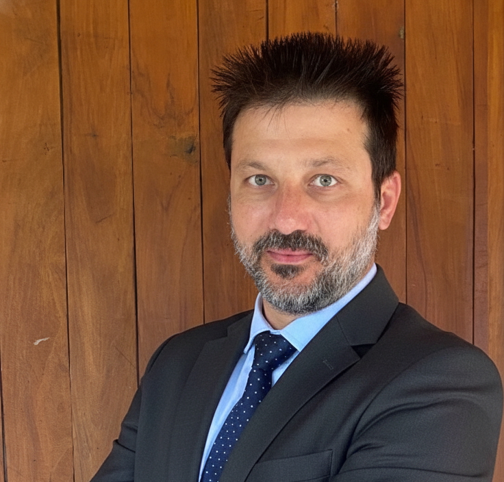 Mario Cezzare smiling in a blue shirt